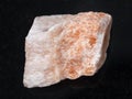 rough Selenite stone on dark background