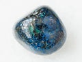 tumbled Azurite gemstone on white