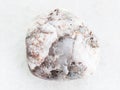 tumbled marble gemstone on white marble