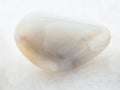 tumbled white Agate gemstone on white