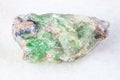 rough green Beryl crystals on white