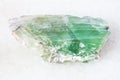 slab from green Beryl gemstone on white