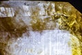 macro shooting of natural rock specimen. Raw crystal of Citrine yellow quartz gemstone from Brazil. Shimmering gold