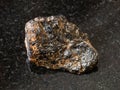Rough Cassiterite Tin ore stone on black Royalty Free Stock Photo