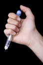 Holding a Penicillin Syringe