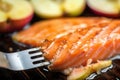 macro shot of apple cider bbq salmon texture on fork