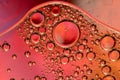 Macro shot of backlit liquid with small bubbles in it over colored background Royalty Free Stock Photo