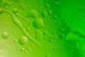 Macro shot of backlit water-oil emulsion over colored background Royalty Free Stock Photo