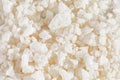 Macro shot of bath sea salt crystals on white background wiht copy space