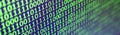 Macro shot of binary code on the monitor of an office computer. The concept of the programmer`s work. The flow of digital informa Royalty Free Stock Photo