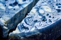 macro shot of blue mold veins in a blue cheese wheel Royalty Free Stock Photo