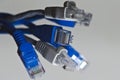 Macro shot of a blue RJ45 Ethernet cable. Internet cable, Patchcord, router cable, web access Royalty Free Stock Photo