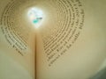 Macro Shot Of A Book Page Folded Into A Circle Creating A Tunnel-like View