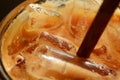 Macro shot of brown straw in ice coffee