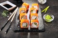 Macro shot of california maki sushi rolls with rice, cream cheese, imitation crab meat, cucumber, orange flying fish caviar and no Royalty Free Stock Photo