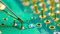 Precision Work on an Electronic Circuit Board Royalty Free Stock Photo