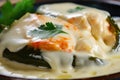 Macro shot of Chiles Rellenos filled with juicy shrimp and topped with a creamy garlic sauce