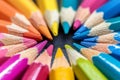 Macro shot of color pencils tipped nibs arranged diagonally, desk Royalty Free Stock Photo