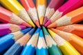 Macro shot of color pencils tipped nibs arranged diagonally, desk