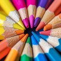 Macro shot of color pencils tipped nibs arranged diagonally, desk