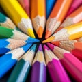 Macro shot of color pencils tipped nibs arranged diagonally, desk