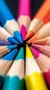 Macro shot of color pencils tipped nibs arranged diagonally, desk