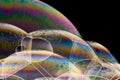 Macro shot of colorful soap bubbles on a dark background Royalty Free Stock Photo