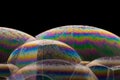 Macro shot of colorful soap bubbles on a dark background Royalty Free Stock Photo