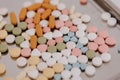 Macro Shot of colour Pills and Capsules During Production and Packing Process on Modern Pharmaceutical Factory. Tablet and Capsule Royalty Free Stock Photo