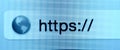 Macro shot of computer screen with https:// address bar and web