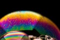 Macro shot of a curved soap bubble texture isolated against a black background Royalty Free Stock Photo