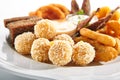 Deep-Fried Snack Plate with Crisp Potato Croquettes and Cheese Balls