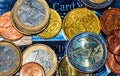 Macro shot of different European coins lying on a creditcard