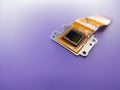 Macro shot of a digital camera Ccd sensor in yellow color isolated against a purple background Royalty Free Stock Photo