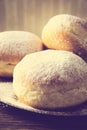 Macro shot doughnuts on tray in old-fashioned wallpaper