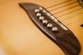 Macro shot down the fretboard of acoustic guitar with shallow depth of field Royalty Free Stock Photo