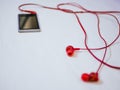 Macro shot of earbuds connected to the mp3 player Royalty Free Stock Photo