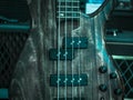 Macro shot of electric guitar, wooden surface