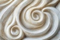 Macro shot of eroded sandstone texture, intricate wind-carved patterns forming delicate swirls.