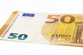 Macro shot of a European Union banknote of 50 EUR, close-up of the number fifty, isolated on a white background, selective focus. Royalty Free Stock Photo