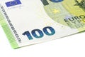 Macro shot of a European Union banknote of 100 EUR, close-up of the number one hundred, isolated on a white background, selective Royalty Free Stock Photo