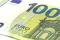 Macro shot of a European Union banknote of 100 EUR, close-up of the number one hundred, isolated on a white background, selective Royalty Free Stock Photo