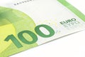 Macro shot of a European Union banknote of 100 EUR, close-up of the number one hundred, isolated on a white background, selective Royalty Free Stock Photo