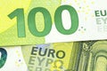 Macro shot of a European Union banknote of 100 EUR, close-up of the number one hundred, selective focus. Royalty Free Stock Photo