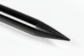Close up of a sharpened black pencil tip on a white background Royalty Free Stock Photo