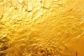 macro shot of gold foil on plain surface