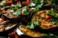 macro shot of grilled eggplant slices topped with a spoonful of ratatouille and garnished with fresh herbs and spices