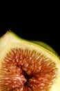 Macro shot of a half fig on a dark background Royalty Free Stock Photo