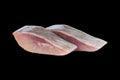 Macro shot herring fillet slices isolated on black background. Matie filet isolated. Fresh herring fish slice isolated