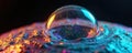 Macro shot of iridescent soap bubble with colorful particles inside, resting on textured alien planet surface. Abstract Royalty Free Stock Photo